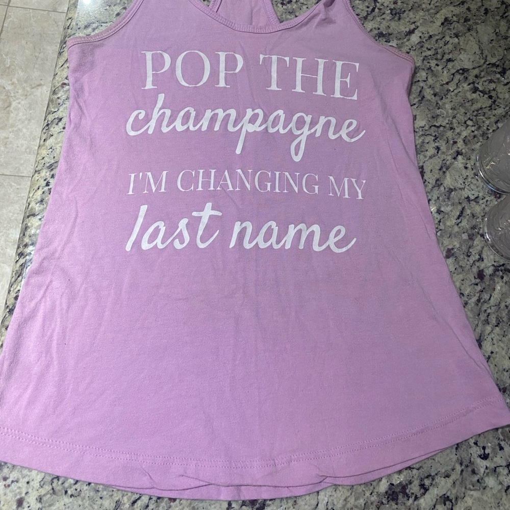 “Pop the champagne, I’m changing my last name” tank top